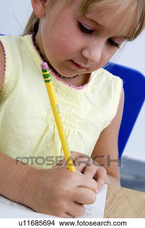 Girl doing homework View Large Photo Image Picture - Girl doing homework. Fotosearch