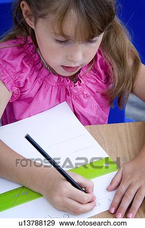 Stock Photo - Girl doing homework. Fotosearch