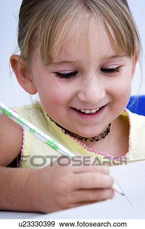 Stock Photo - Girl doing homework. Fotosearch