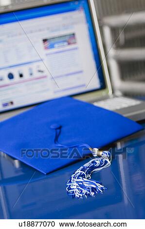 Graduation cap and tassel setting on laptop computer View Large Photo Image Stock Image - Graduation cap and tassel setting on laptop computer. Fotosearch