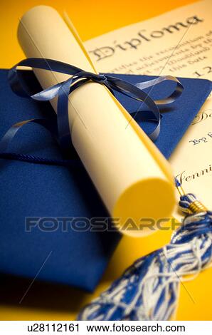Stock Image - Graduation cap diploma and tassel. Fotosearch