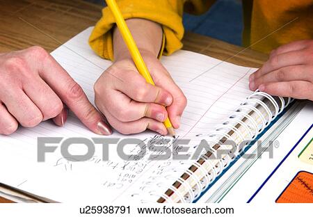 Mother or teacher helping boy with homework View Large Photo Image Stock Image - Mother or teacher helping boy with homework. Fotosearch