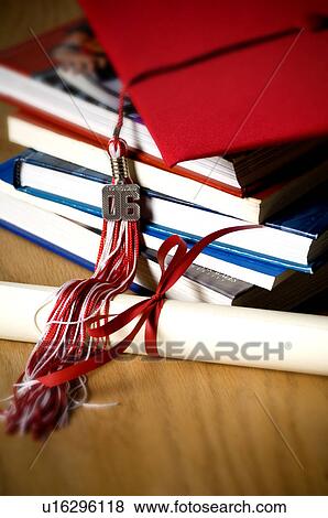 School books graduation cap tassel and diploma View Large Photo Image Stock Photo - School books graduation cap tassel and diploma. Fotosearch