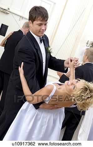 Stock Image - Bride and groom dancing. Fotosearch