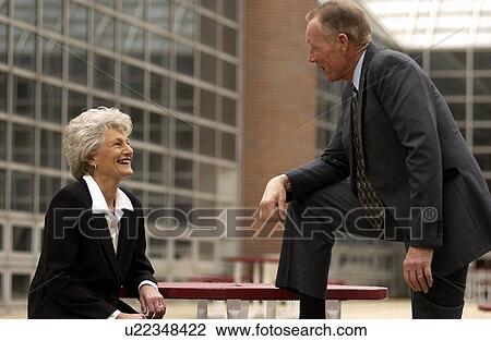 Businessman and businesswoman talking View Large Photo Image Stock Image - Businessman and businesswoman talking. Fotosearch