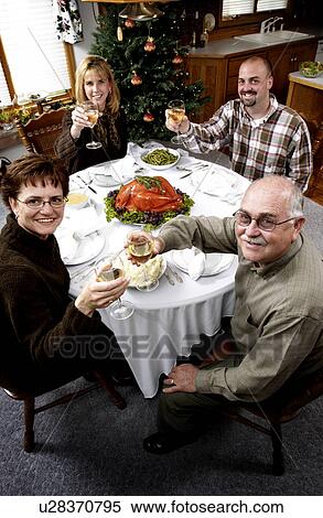 Stock Photography - Family having holiday dinner. Fotosearch