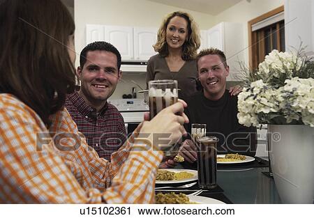 Friends at dinner View Large Photo Image Stock Image - Friends at dinner. Fotosearch