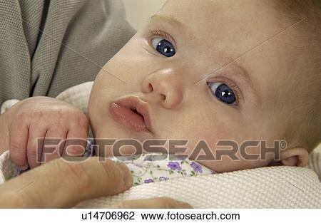 Parent holding infant View Large Photo Image Stock Image - Parent holding infant. Fotosearch