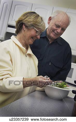 Senior couple in kitchen View Large Photo Image Stock Photo - Senior couple in kitchen. Fotosearch