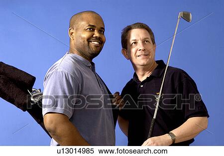 Stock Photography - Two men out on a golf course. Fotosearch