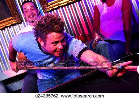 Young adults at a nightclub playing pool View Large Photo Image Stock Image - Young adults at a nightclub playing pool. Fotosearch