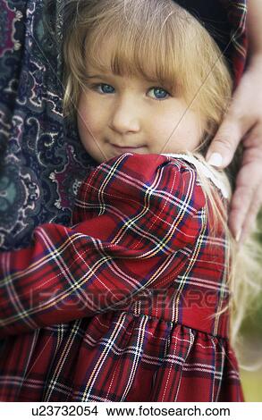 Young girl hugging mother View Large Photo Image Picture - Young girl hugging mother. Fotosearch