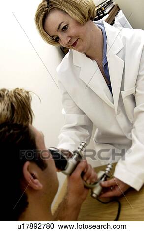 Stock Image - Man having physical therapy Man having physical therapy . Fotosearch
