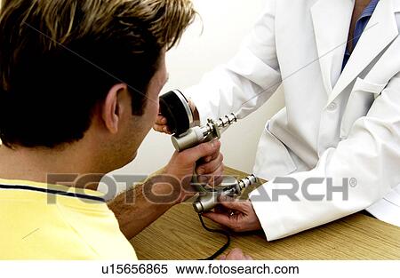 Stock Photography - Man having physical therapy. Fotosearch