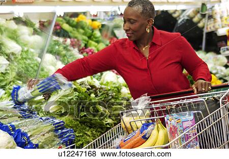 Older woman grocery shopping View Large Photo Image Stock Photo - Older woman grocery shopping. Fotosearch