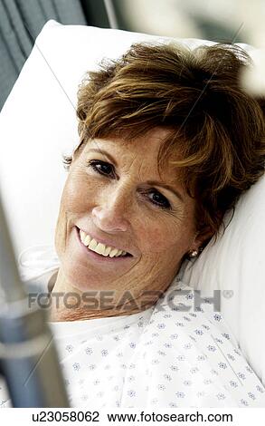 Stock Image - Patient in hospital bed. Fotosearch