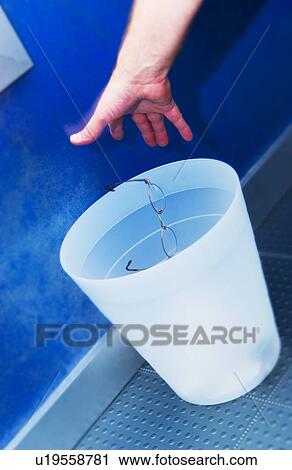 Throwing eyeglasses in trash can View Large Photo Image Stock Image - Throwing eyeglasses in trash can. Fotosearch