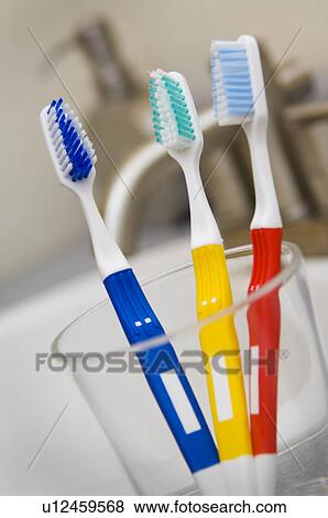 Toothbrushes in glass View Large Photo Image Stock Photo - Toothbrushes in glass. Fotosearch