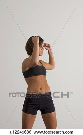 Stock Photograph - Woman exercising. Fotosearch