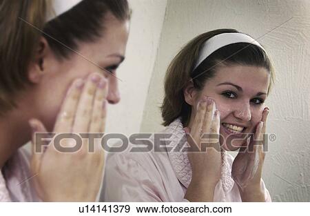 Woman washing face View Large Photo Image Stock Photo - Woman washing face. Fotosearch