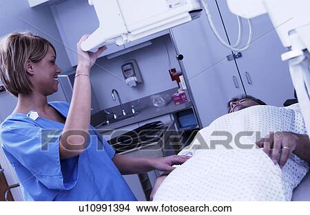 Xray tech taking xrays View Large Photo Image Picture - Xray tech taking xrays. Fotosearch