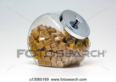 Stock Photo - Caramels in glass container. Fotosearch