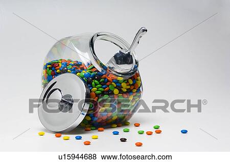 Chocolate candy in glass container with metal lid off View Large Photo Image Stock Photo - Chocolate candy in glass container with metal lid off. Fotosearch