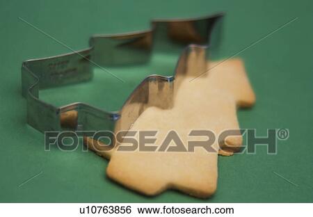 Christmas cookie and cutter View Large Photo Image Stock Photograph - Christmas cookie and cutter. Fotosearch