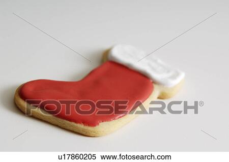 Stock Photography - Decorated stocking shaped Christmas cookie. Fotosearch