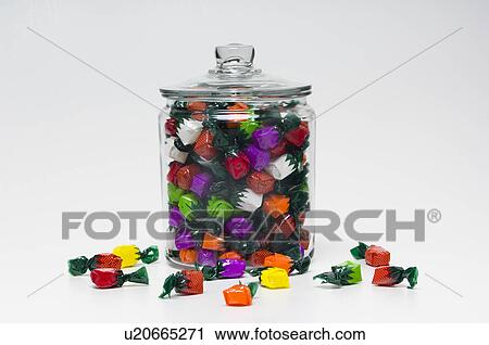 Fruit flavored hard candy in glass container with lid View Large Photo Image Stock Image - Fruit flavored hard candy in glass container with lid. Fotosearch