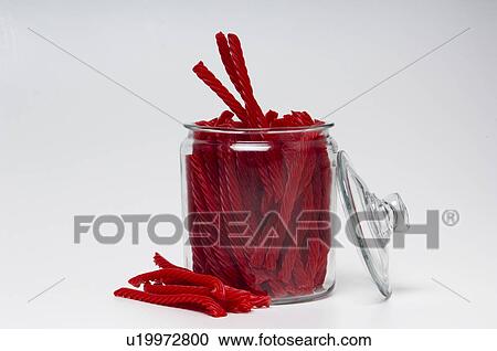 Licorice in glass container with lid off View Large Photo Image Stock Image - Licorice in glass container with lid off. Fotosearch