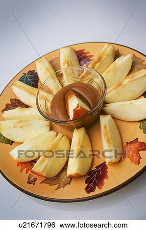 Plate of apples with caramel dip View Large Photo Image Stock Photograph - Plate of apples with caramel dip. Fotosearch