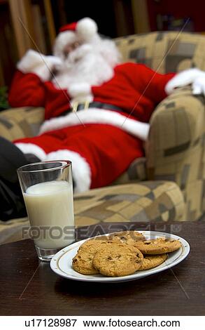 Santa sleeping on chair View Large Photo Image Stock Photo - Santa sleeping on chair. Fotosearch