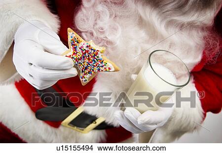 Santa with cookie and milk View Large Photo Image Picture - Santa with cookie and milk. Fotosearch