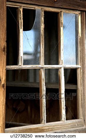Stock Image - Broken windows in abandoned house. Fotosearch