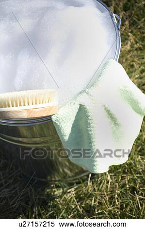 Cleaning cloth and brush in bucket of soapy water View Large Photo Image Stock Photography - Cleaning cloth and brush in bucket of soapy water. Fotosearch