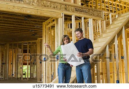 Couple building home View Large Photo Image Stock Image - Couple building home. Fotosearch
