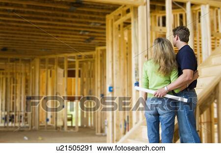 Couple building home View Large Photo Image Stock Image - Couple building home. Fotosearch