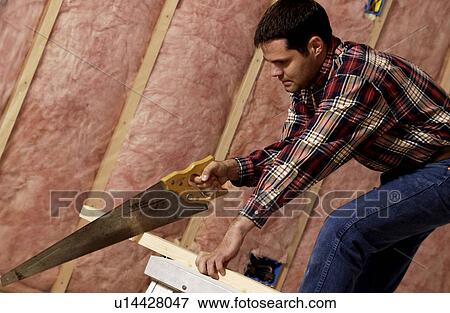 Man cutting lumber View Large Photo Image Stock Photo - Man cutting lumber. Fotosearch