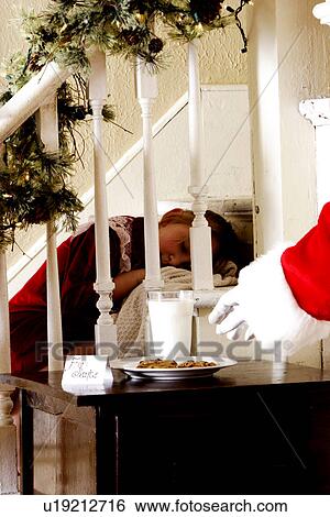 Child sleeping during Santas visit View Large Photo Image Stock Photograph - Child sleeping during Santas visit. Fotosearch