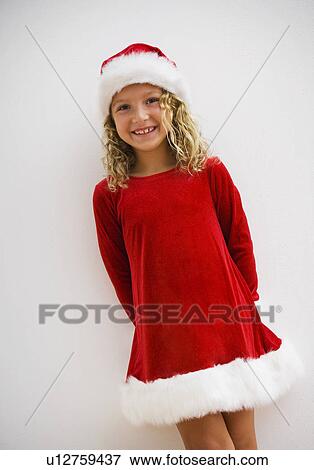 Girl in Christmas dress View Large Photo Image Stock Photo - Girl in Christmas dress. Fotosearch