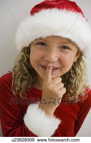 Stock Photo - Girl in Christmas dress. Fotosearch