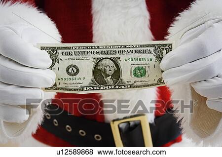 Santa holding money View Large Photo Image Stock Photo - Santa holding money. Fotosearch