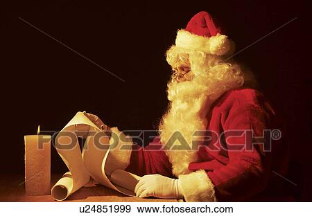 Santa making a list View Large Photo Image Stock Photo - Santa making a list. Fotosearch