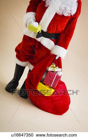 Santa with bag of gifts View Large Photo Image Stock Image - Santa with bag of gifts. Fotosearch