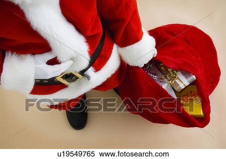Santa with bag of gifts View Large Photo Image Stock Photography - Santa with bag of gifts. Fotosearch