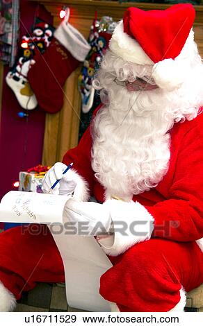 Santa with list View Large Photo Image Stock Photo - Santa with list. Fotosearch