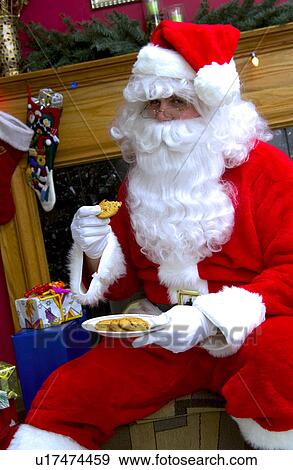 Santa with plate of cookies View Large Photo Image Stock Photo - Santa with plate of cookies. Fotosearch