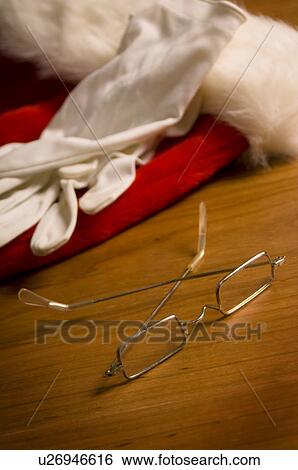 Santa's glasses, gloves, and hat View Large Photo Image Stock Photograph - Santa's glasses, gloves, and hat. Fotosearch