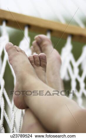 Feet in hammock View Large Photo Image Picture - Feet in hammock. Fotosearch